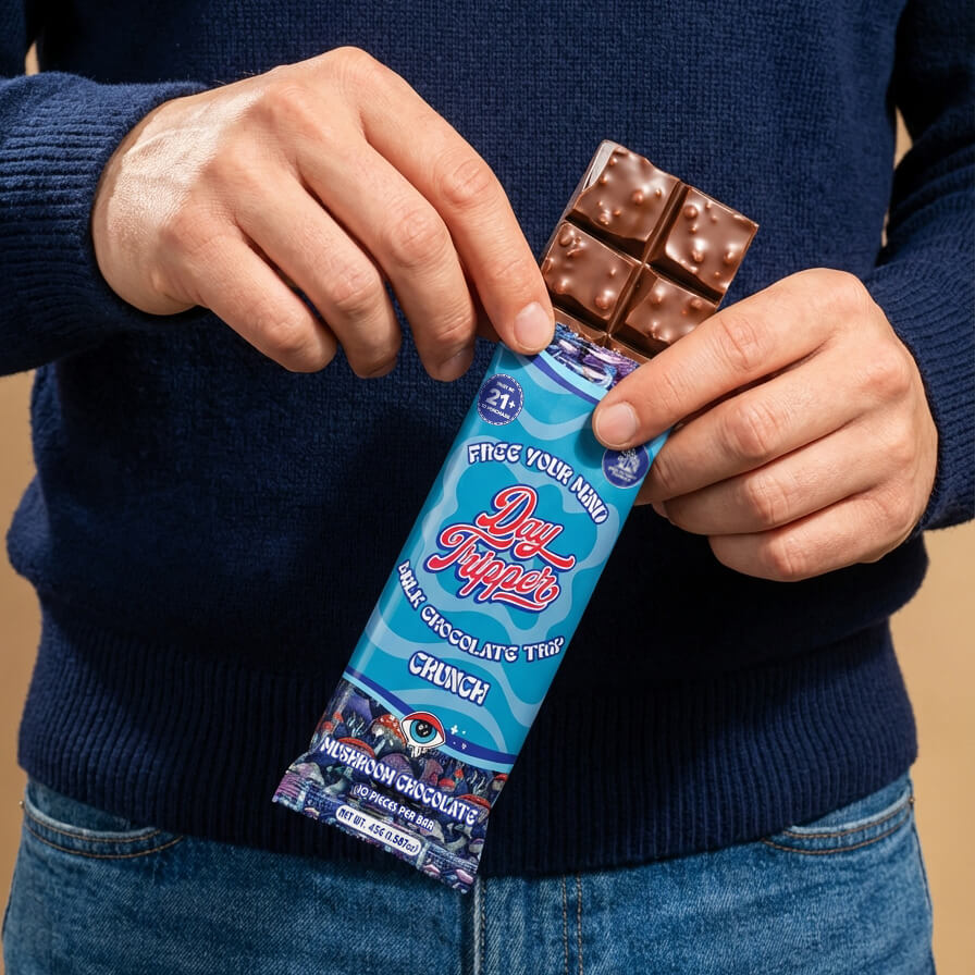 Day Tripper Mushroom Chocolates collection featuring Milk Chocolate, Cookies & Cream, and Crunch bars in colorful wrappers.